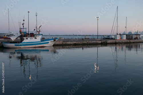 boats in the harbor at sunset © Sandro