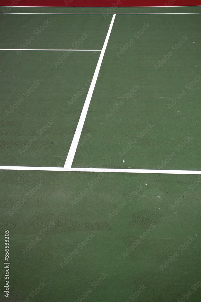 Obraz premium Various angles of green tennis courts with white stripes and nets