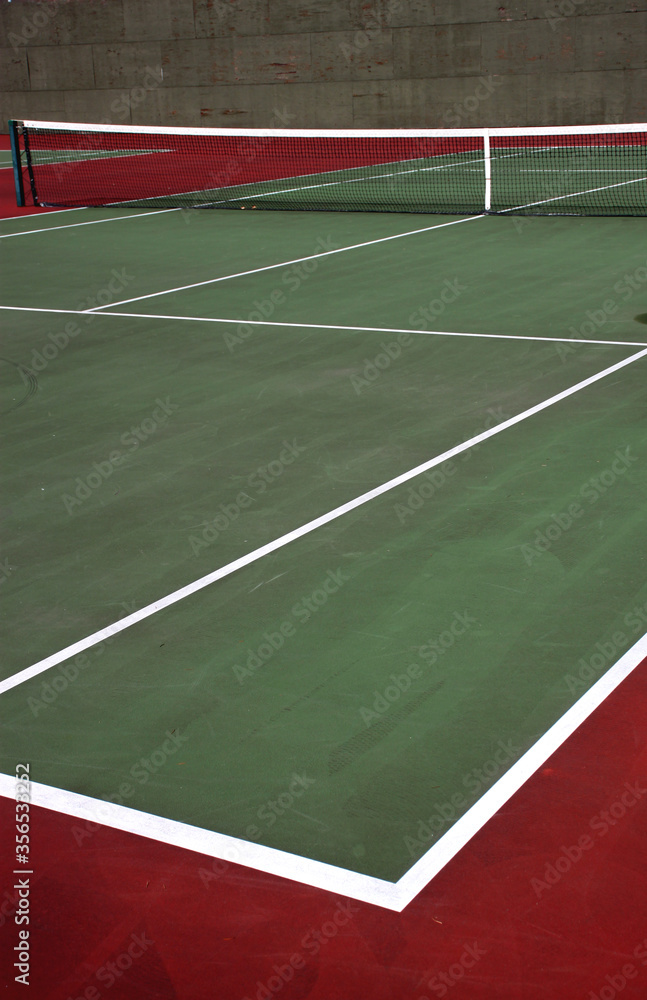 Various angles of green tennis courts with white stripes and nets