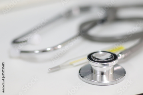 Stethoscope isolated equipment on white texture with blurred background