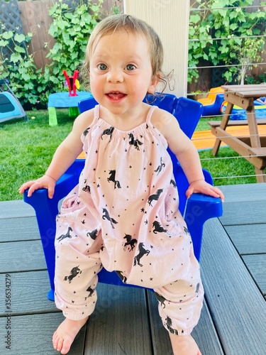 Cute and Adorable 1 Years Old Baby girl Sitting in the Porch  in Pink Stylish, fancy outfit, Happy Baby