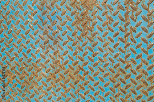 diamond plate texture of a metal surface with rust