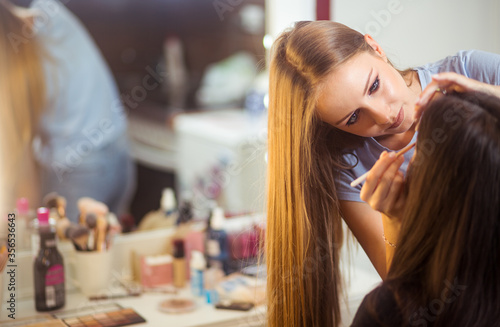 Professional makeup artist work in her studio