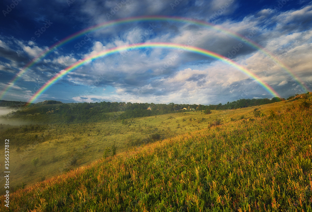Beautiful landscape with a rainbow in the sky Beautiful landscape with a rainbow in the sky
