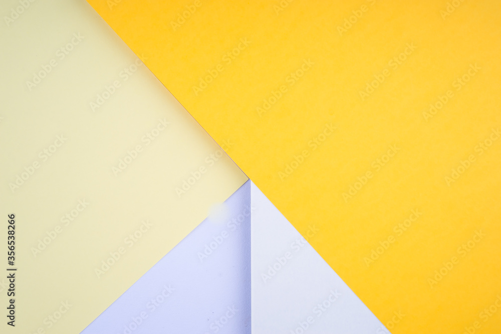 Creative arrangement of soft pastel colored papers creating an abstract background Creative arrangement of soft pastel colored papers creating an abstract background