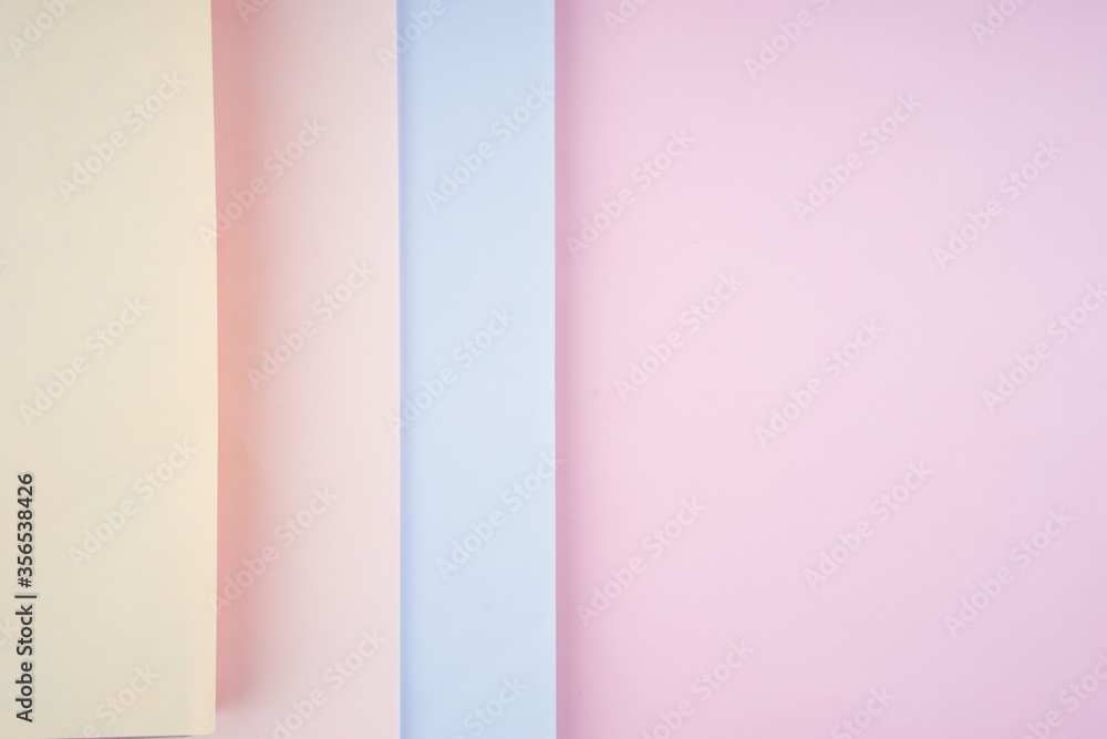 Creative arrangement of soft pastel colored papers creating an abstract background Creative arrangement of soft pastel colored papers creating an abstract background
