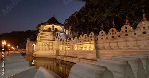 Temple of the Tooth Relic and Reflections Before Dawn in Kandy Sri Lanka. photo