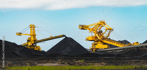 Coal mining machinery, heavy equipment sorting and grading fossil fuels in Australia. photo