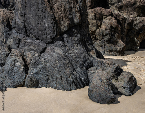 black rock and white sand