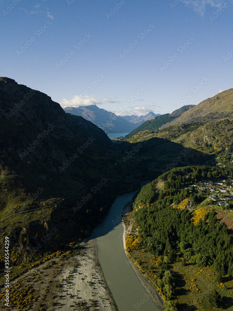 Aerial photos around Arthurs Point in Queenstown, New Zealand taken in the morning before the summer season with views of the shotover river, Coronet's peak, Queenstown hill and Bowen Peak.