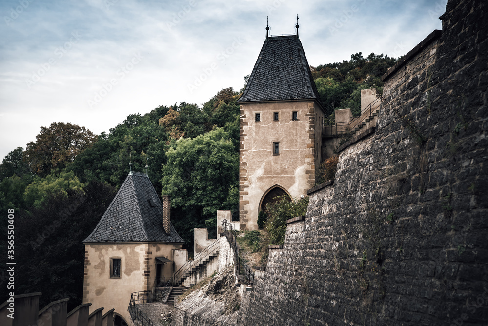 Towers and walls of famous medieval Karlstejn castle. Karlstein village, Central Bohemia, Czech Republic