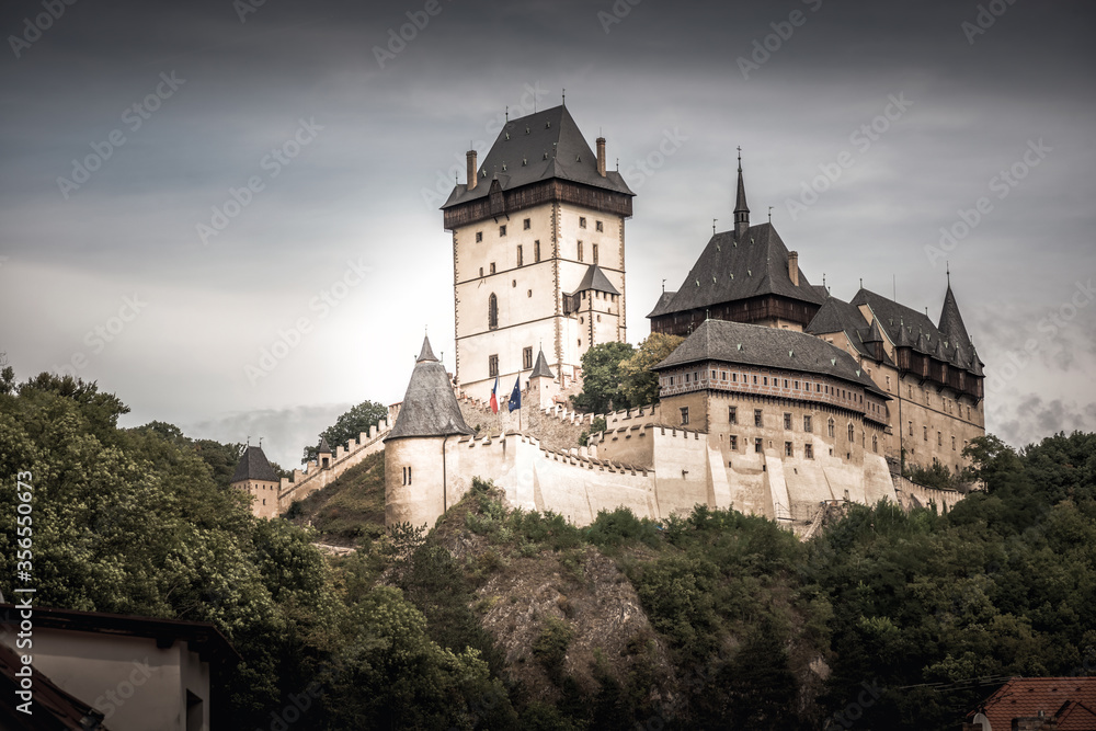View of Karlstein Castle, a large Gothic castle founded in 1348 by King Charles IV. Karlstein village, Central Bohemia, Czech Republic