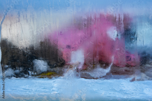 Photo of a man through transparent ice