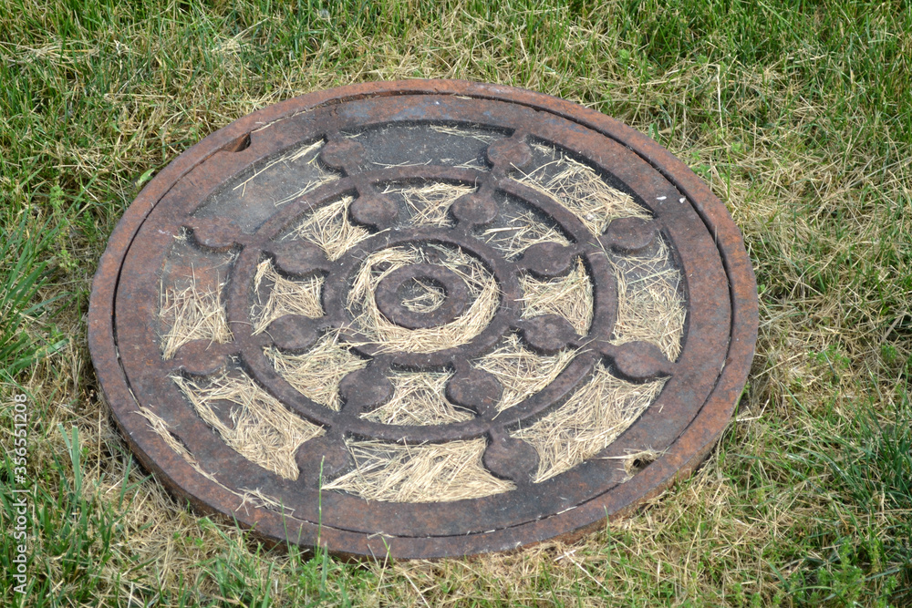 A Man Hole Cover Outdoors