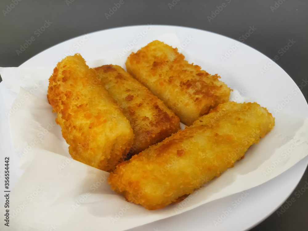 Fried Risoles with Chili on Black Background. Blurry Background Fried Risoles with Chili on Black Background. Blurry Background
