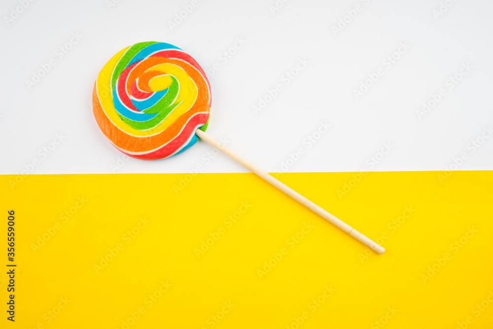 Candies and Sweets concept. Colorful lollipops on vibrant colored background Candies and Sweets concept. Colorful lollipops on vibrant colored background