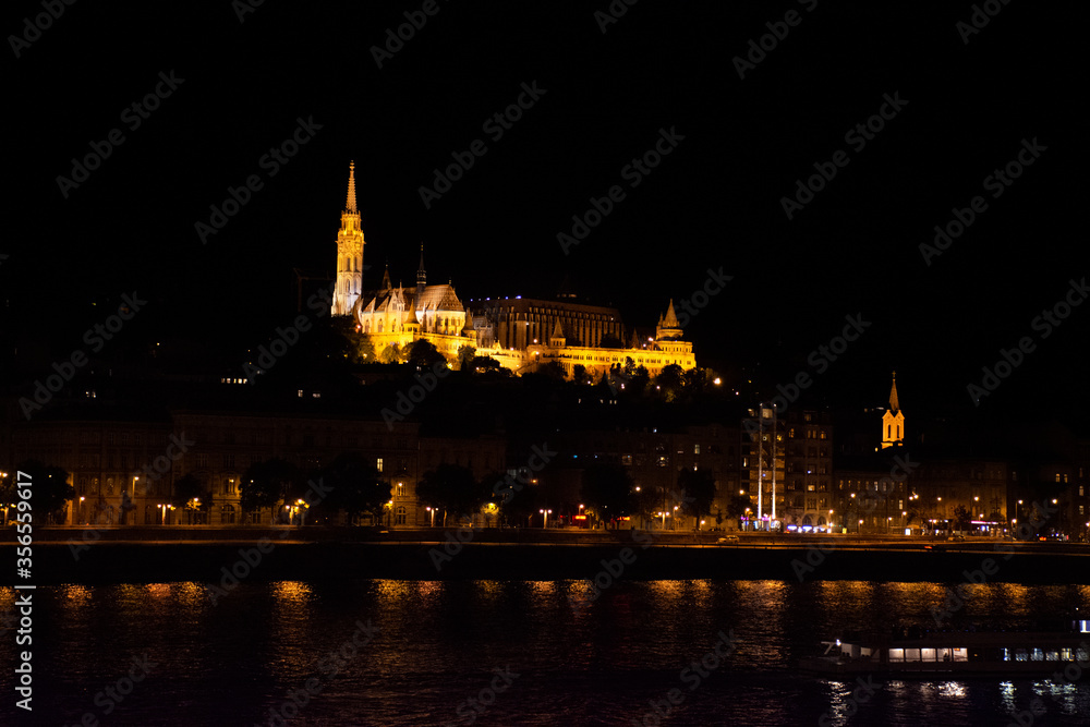 View landscape and cityscape of Budapest old town and Budapest Castle Hill or Buda Castle Royal Palace with Danube Delta river and Budapest Chain Bridge in night time in Budapest, Hungary