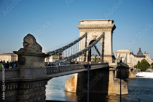 Hungarians people walking visit on Budapest Chain Bridge cross Danube river with Budapest Castle Hill or Buda Royal Palace on September 22, 2019 in Budapest, Hungary