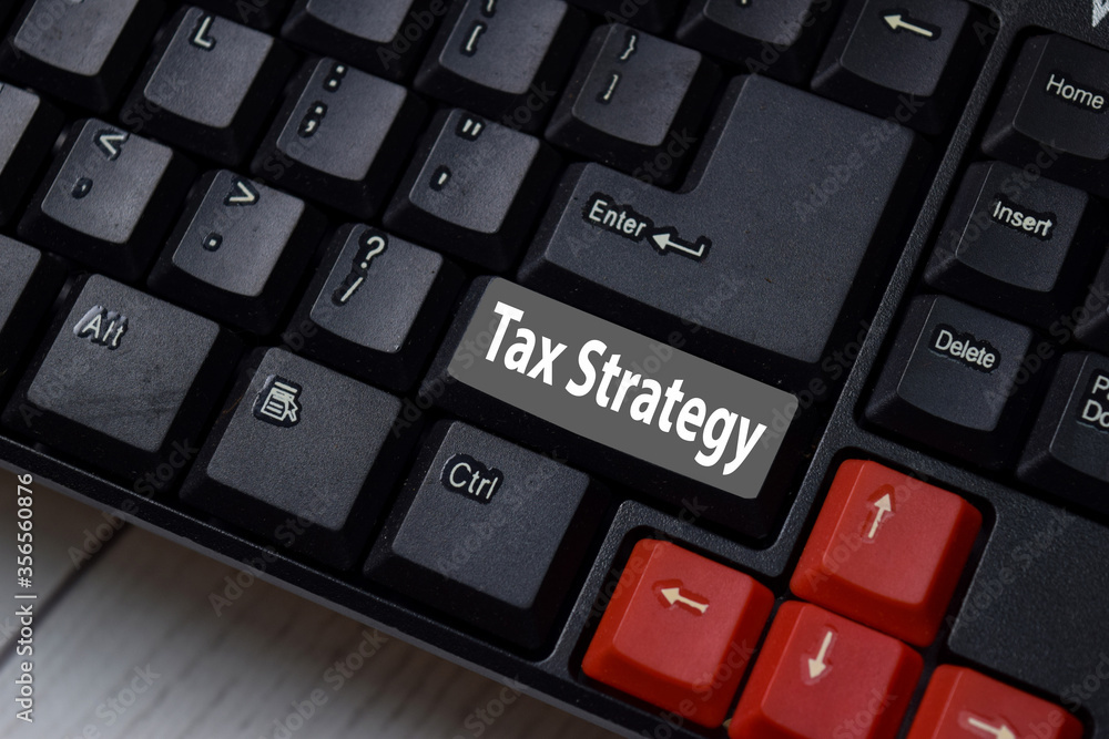 Tax Strategy write on keyboard isolated on laptop background Tax Strategy write on keyboard isolated on laptop background