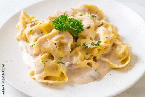 tortellini pasta with mushroom cream sauce and cheese