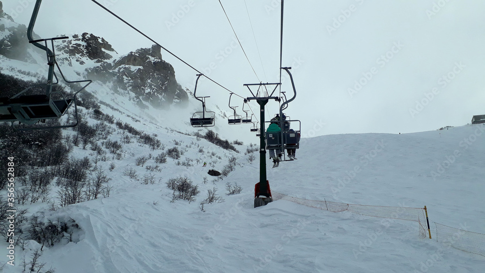 skiers on ski lift skiers on ski lift