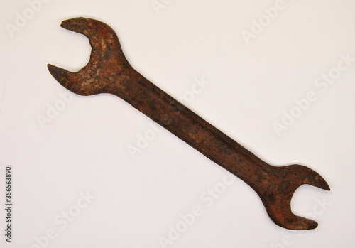 old rusty spanner. old rusty wrench. view from above