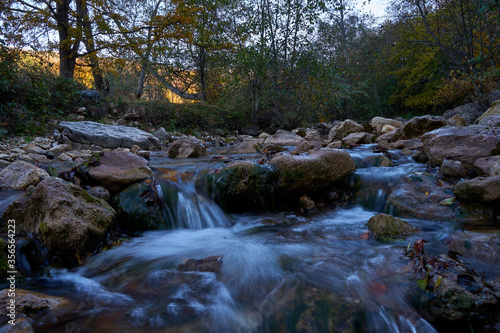 Image of an oil stain in a mountain stream.