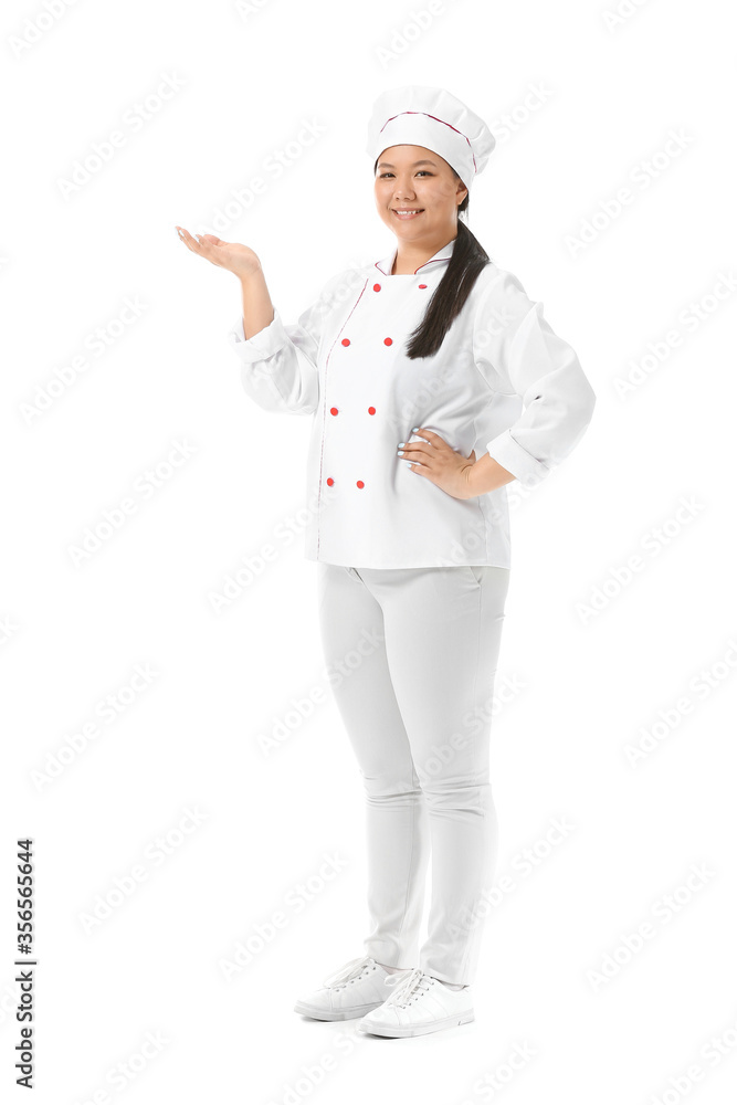 Beautiful Asian chef showing something on white background