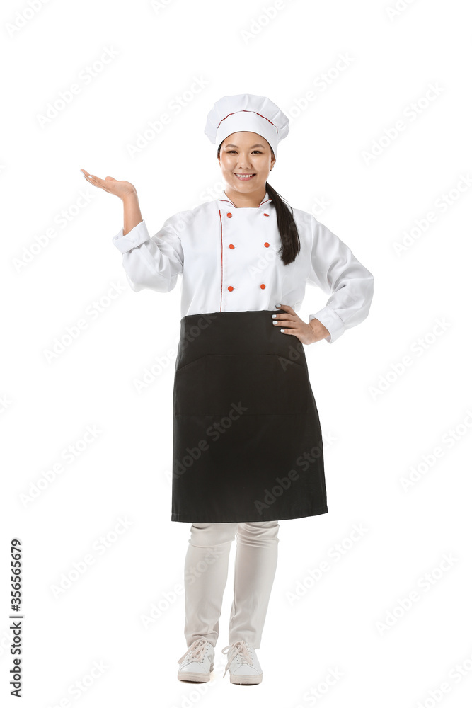 Beautiful Asian chef showing something on white background Beautiful Asian chef showing something on white background