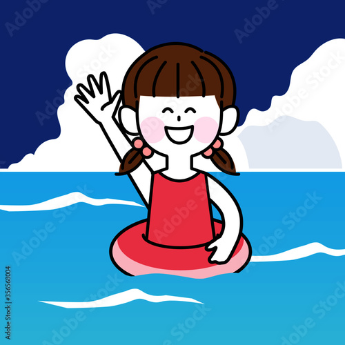 海水浴を楽しむ浮き輪をつけた子ども