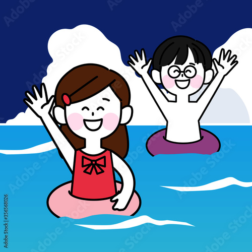 海水浴を楽しむ浮き輪をつけた子ども