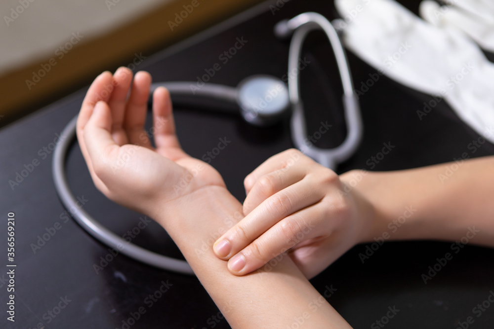 Doctor checking patient blood pressure and pulse close-up Image Doctor checking patient blood pressure and pulse close-up Image