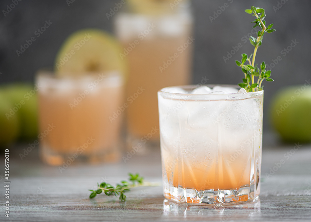 freshly squeezed grapefruit juice with thyme and ice freshly squeezed grapefruit juice with thyme and ice