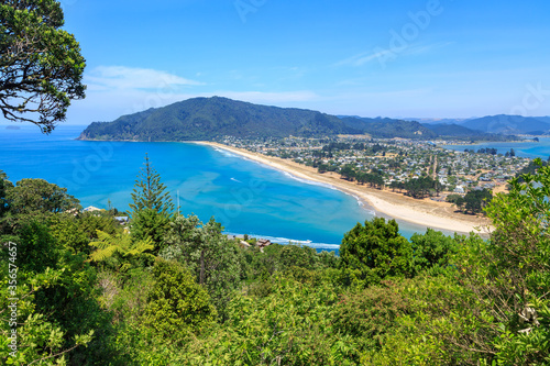 The holiday town of Pauanui, New Zealand, on the coastline of the Coromandel Peninsula. Seen from Mount Paku across the harbor