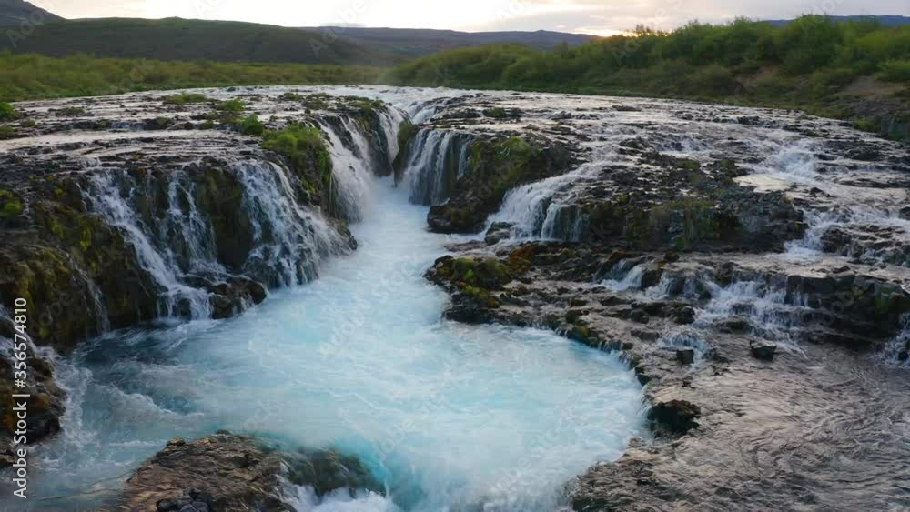 4K video (Ultra High Definition) of of Bruarfoss Waterfall, secluded spot with cascading blue waters. Superb sunrise in Iceland, Europe. Beauty of nature concept background. 4K video (Ultra High Definition) of of Bruarfoss Waterfall, secluded spot with cascading blue waters. Superb sunrise in Iceland, Europe. Beauty of nature concept background.