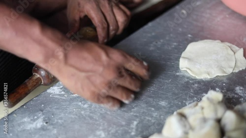 Kneading Indian bread dough for momos or samosa using a belan.