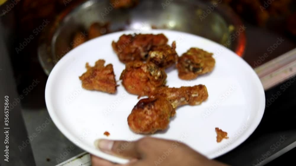 Deep frying chicken in an India Kadhai at a street food market in Zakir Nagar, Delhi Deep frying chicken in an India Kadhai at a street food market in Zakir Nagar, Delhi