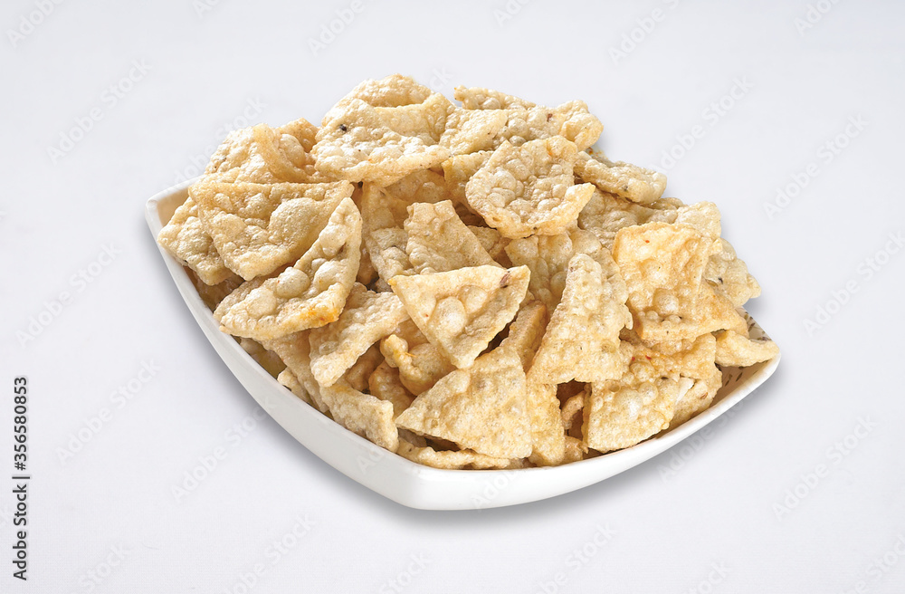 Deep fried Khichiya Papad, Traditional Indian Snacks, Indian crunchy fried snack papad or Papadam made of rice floor served in a plate. Also known as khichiya Papad. desi khichiya Deep fried Khichiya Papad, Traditional Indian Snacks, Indian crunchy fried snack papad or Papadam made of rice floor served in a plate. Also known as khichiya Papad. desi khichiya