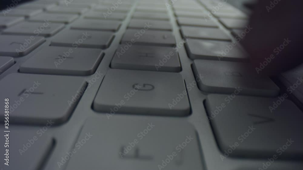 Male hands typing on computer keyboard. Unrecognizable man using keyboard Male hands typing on computer keyboard. Unrecognizable man using keyboard