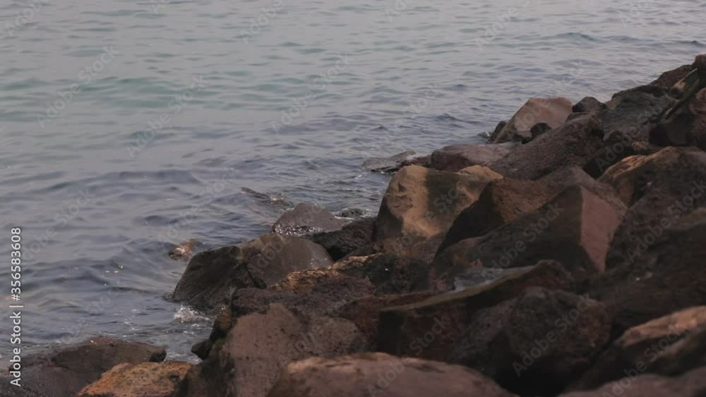 Rocks by St Kilda Pier where penguins live, calm water, day time Australia, Melbourne Rocks by St Kilda Pier where penguins live, calm water, day time Australia, Melbourne