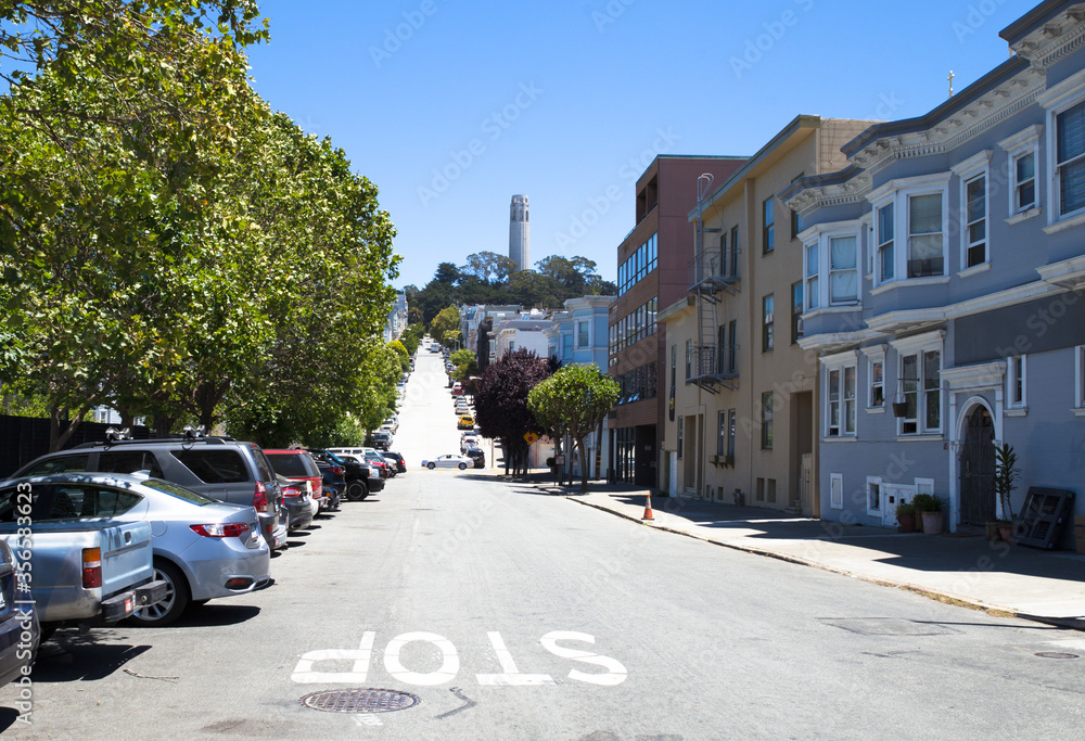 street painted stop with with Coit Tower in the background in San Francisco