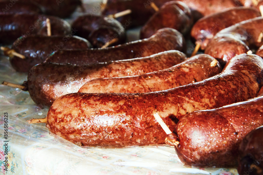 Fototapeta premium Many grilled spicy sausage on table.