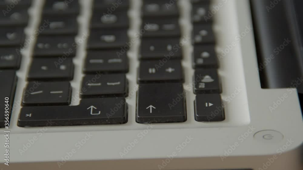 Finger pressing the backspace key on laptop keyboard in several manners Finger pressing the backspace key on laptop keyboard in several manners