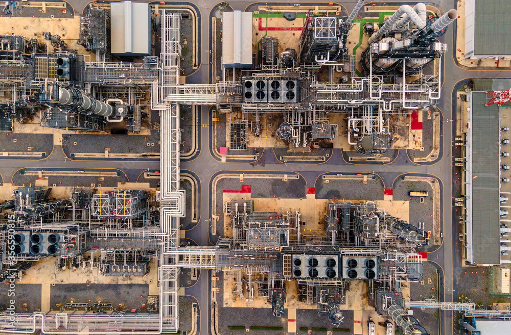Oil refinery plant from industry zone, Aerial view oil and gas petrochemical industrial, Refinery factory oil storage tank and pipeline steel at twilight. Oil refinery plant from industry zone, Aerial view oil and gas petrochemical industrial, Refinery factory oil storage tank and pipeline steel at twilight.