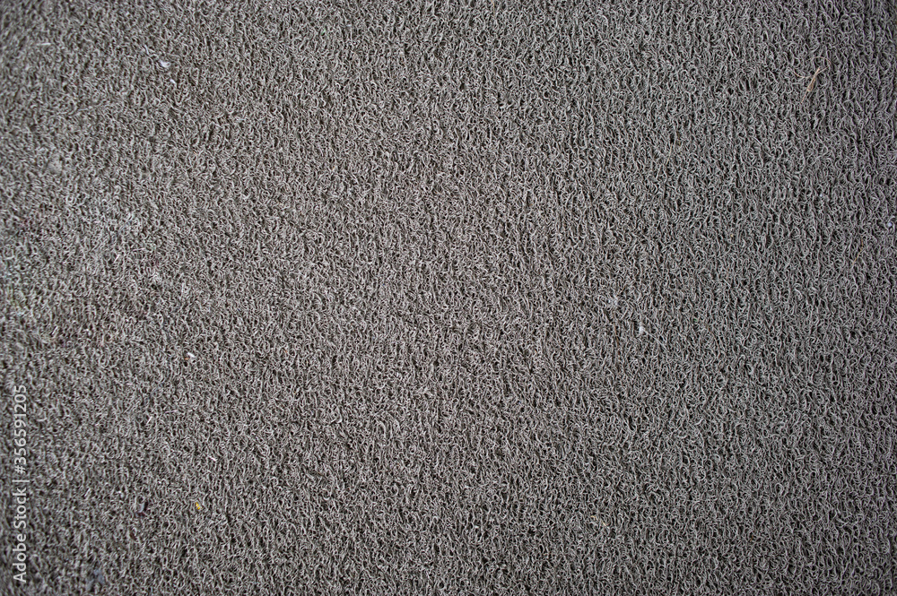 Gray doormat which is made from synthetic fibers. Gray doormat which is made from synthetic fibers.