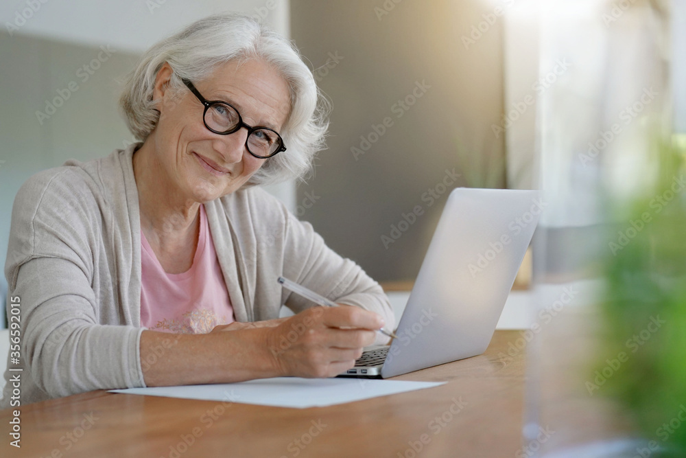 Senior woman using laptop computer at home Senior woman using laptop computer at home