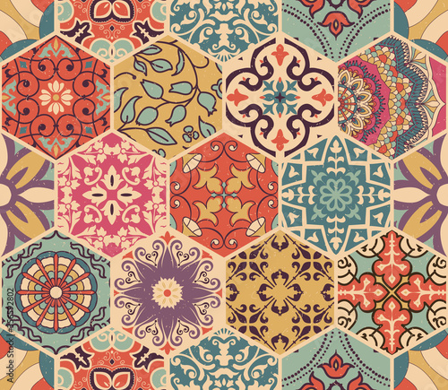 Seamless colorful patchwork tile with Islam, Arabic, Indian, Ottoman motifs. Majolica pottery tile. Portuguese and Spain decor. Azulejo. Ceramic tile in talavera style. Boho pattern