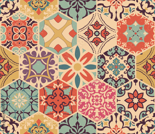 Seamless colorful patchwork tile with Islam, Arabic, Indian, Ottoman motifs. Majolica pottery tile. Portuguese and Spain decor. Azulejo. Ceramic tile in talavera style. Boho pattern