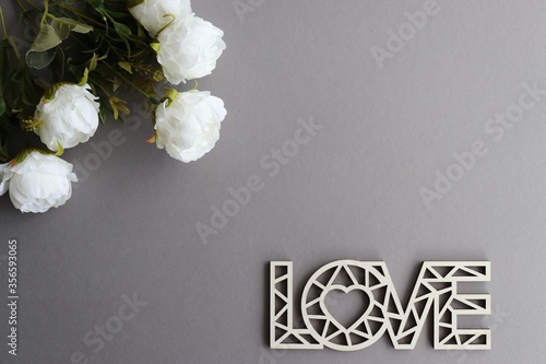 
bouquet of white roses on a gray background