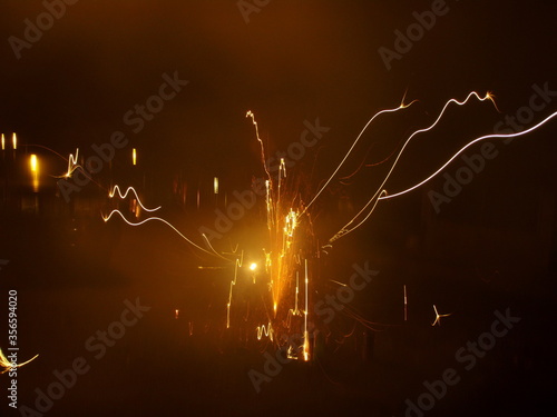 Streaks from embers of a firework